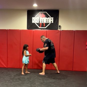 Fastsigns - I purchased my husband's first company sign for his small gym. Coach Hector and our granddaughter Kealani. - Printing Services Near Me - San Jose, California Fastsigns - I purchased my husband's first company sign for his small gym. Coach Hector and our granddaughter Kealani. - Printing Services Near Me - San Jose, California