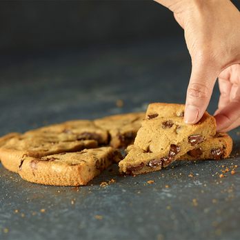 Papa Johns Pizza - a hand picking up a piece of chocolate chip cookie - Chicken Wings Near Me - Medford, New Jersey Papa Johns Pizza - a hand picking up a piece of chocolate chip cookie - Chicken Wings Near Me - Medford, New Jersey