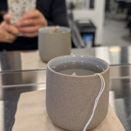 They offer tea... and is in a ceramic mug, not in a paper cup! Treat yourself!