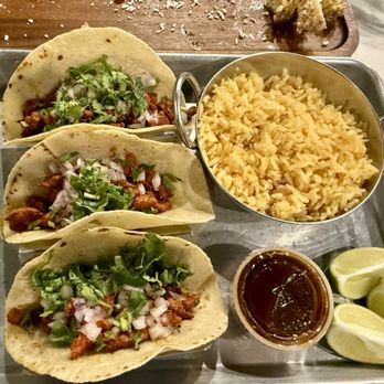 Una Mas - Tacos Al Pastor with hot sauce limes and rice - Mexican Near Me - Asheboro, North Carolina