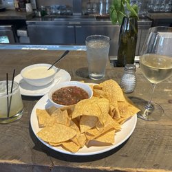 The Farmhouse Bistro and Bar - Chips n salsa plus queso. Wine + margarita