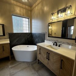 Extra Mile Builders - Replaced tub, vanities, floor tile, wall tile, lights, mirrors and plumbing