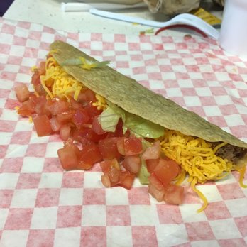 Taco Shop - a taco on a checkered paper - Mexican Near Me - Corsicana, Texas Taco Shop - a taco on a checkered paper - Mexican Near Me - Corsicana, Texas