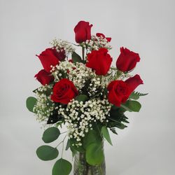 J J's Floral Shop - Dozen Red Roses arranged in a vase.