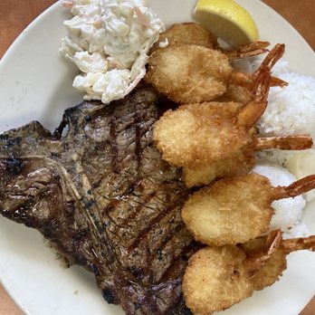 Ray's Café - T-Bone steak,medium w/a generous amount of fried shrimp! Was told 5 pcs but look! - American Near Me - Honolulu, Hawaii Ray's Café - T-Bone steak,medium w/a generous amount of fried shrimp! Was told 5 pcs but look! - American Near Me - Honolulu, Hawaii
