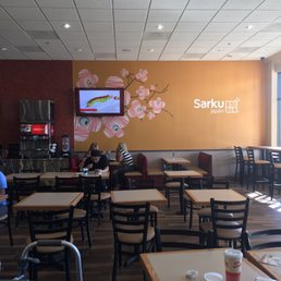 people sitting at tables in a restaurant