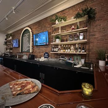 Nights & Weekends Pizzeria - View of my seat at the bar with my mostly eaten Calabrese pizza. - Pizza Near Me - Ashtabula, Ohio Nights & Weekends Pizzeria - View of my seat at the bar with my mostly eaten Calabrese pizza. - Pizza Near Me - Ashtabula, Ohio