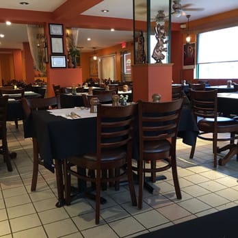 Rangoli Indian Cuisine & Sweets - Seating area complete with traditional hand carved furniture - Indian Near Me - Orleans, Ontario Rangoli Indian Cuisine & Sweets - Seating area complete with traditional hand carved furniture - Indian Near Me - Orleans, Ontario