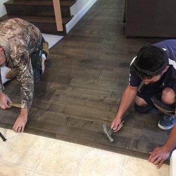 Benicia Floor Company - two men working on a wood floor - Carpeting Near Me - Benicia, California