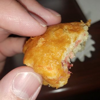 Nothing Bundt Cakes - a hand holding a pastry - Bakeries Near Me - Reno, Nevada