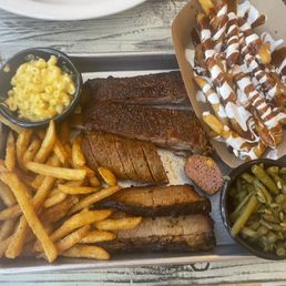 Steve's Sampler; with ribs, brisket, and sausage Steve's Sampler; with ribs, brisket, and sausage