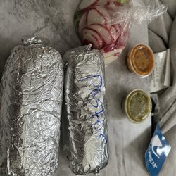 Tacos Arandas - pastor and pollo burrito with salsa and radishes and limes