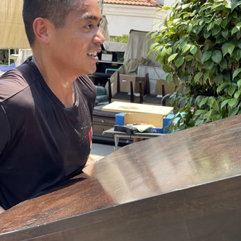 Sergeant Junk Removal - SGT handling our Crate and Barrel table during 100 degree weather Summer 2021. - Junk Removal & Hauling Near Me Sergeant Junk Removal - SGT handling our Crate and Barrel table during 100 degree weather Summer 2021. - Junk Removal & Hauling Near Me