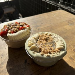 two desserts on a wooden table two desserts on a wooden table