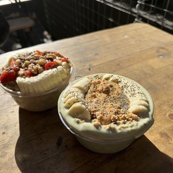 Playa Bowls - two desserts on a wooden table - Juice Bars & Smoothies Near Me - New York, New York Playa Bowls - two desserts on a wooden table - Juice Bars & Smoothies Near Me - New York, New York