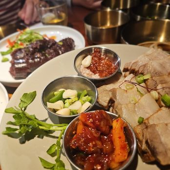 Olle - Sooyuk/수육- Slow-cooked pork belly served with raw garlic & assorted condiments. $38.95. Just OK - Korean Near Me - New York, New York Olle - Sooyuk/수육- Slow-cooked pork belly served with raw garlic & assorted condiments. $38.95. Just OK - Korean Near Me - New York, New York