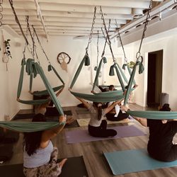 Nkisoy Yoga - Aerial restorative yoga Sundays at 10:15am, a great way to slow down and be present in the moment.