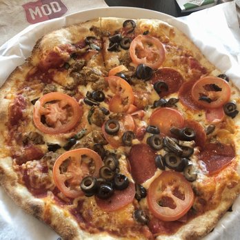 MOD Pizza - BYOP: Red sauce, chicken sausage, pepperoni, black olives, Romas, mozz/asiago cheese. Yum! - Pizza Near Me - Cross Roads, Texas MOD Pizza - BYOP: Red sauce, chicken sausage, pepperoni, black olives, Romas, mozz/asiago cheese. Yum! - Pizza Near Me - Cross Roads, Texas