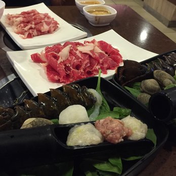 Round N Round Pot - Plate of Lamb (far), Beef (near), and Seafood Tray with Lobster Tail, Clams, Scallop, Fish Ball, and Beef Ball - Hot Pot Near Me - Brisbane, California Round N Round Pot - Plate of Lamb (far), Beef (near), and Seafood Tray with Lobster Tail, Clams, Scallop, Fish Ball, and Beef Ball - Hot Pot Near Me - Brisbane, California