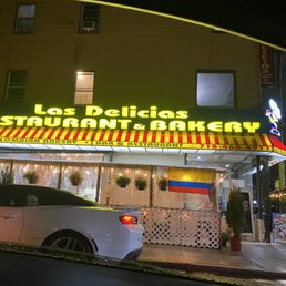 a car parked in front of a restaurant