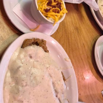Texas Roadhouse - Chicken Fried Sirloin with loaded mashed potatoes and delicious rolls - Steakhouses Near Me - Pflugerville, Texas Texas Roadhouse - Chicken Fried Sirloin with loaded mashed potatoes and delicious rolls - Steakhouses Near Me - Pflugerville, Texas