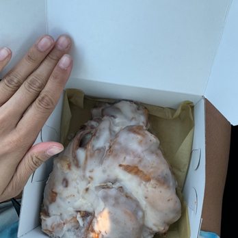 DeEtta's Bakery - Huge Cinnamon roll! Hand for size comparison - Bakeries Near Me - Naperville, Illinois DeEtta's Bakery - Huge Cinnamon roll! Hand for size comparison - Bakeries Near Me - Naperville, Illinois