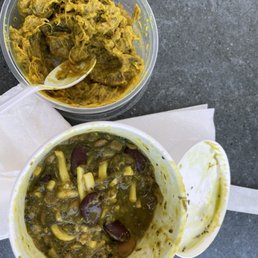two bowls of soup and a spoon