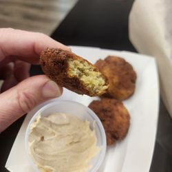 The Falafel has nice crunch but the wrong color. It should have more parsley and maybe a bit more cummin...
