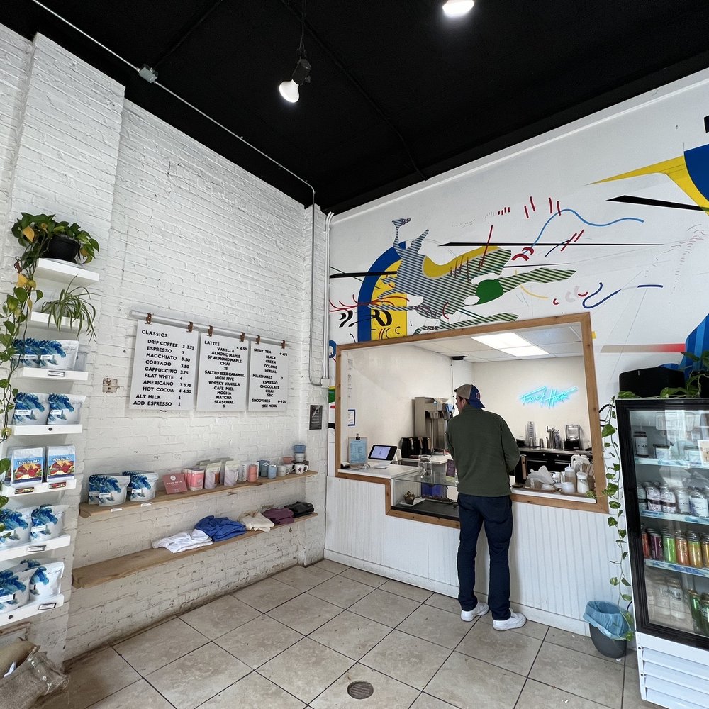 Five & Hoek Coffee - a man standing in a coffee shop - Coffee & Tea Near Me - Wheaton, Illinois