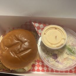 Chicken sandwich with extra sauce and slaw Chicken sandwich with extra sauce and slaw