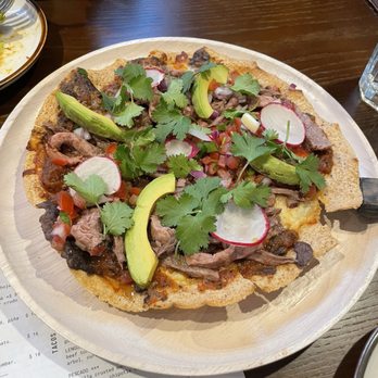 Oro by Nixta - Tlayuda: very steak-heavy interpretation. grande tostada, frijoles, quesillo, beef salpicon, avocado, tatemada salsa - Mexican Near Me - Minneapolis, Minnesota Oro by Nixta - Tlayuda: very steak-heavy interpretation. grande tostada, frijoles, quesillo, beef salpicon, avocado, tatemada salsa - Mexican Near Me - Minneapolis, Minnesota