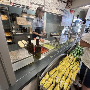 Jersey Mike's Subs - a woman working behind the counter - Fast Food Near Me - Houston, Texas Jersey Mike's Subs - a woman working behind the counter - Fast Food Near Me - Houston, Texas