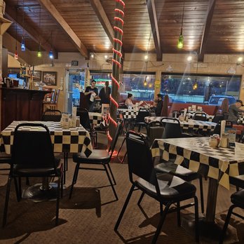 Panino's Westside - a dining area with tables and chairs - Pizza Near Me - Colorado Springs, Colorado Panino's Westside - a dining area with tables and chairs - Pizza Near Me - Colorado Springs, Colorado