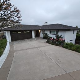 Exterior finished in white with contrasting brown trim, including fascia boards, eaves, and rain gutter system. Exterior finished in white with contrasting brown trim, including fascia boards, eaves, and rain gutter system.