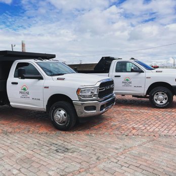 Precise Lawn Care - two trucks parked in a parking lot - Landscaping Near Me - Berea, Ohio Precise Lawn Care - two trucks parked in a parking lot - Landscaping Near Me - Berea, Ohio