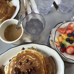 Chocolate chip pancakes, fruit, coffee, sausage! Chocolate chip pancakes, fruit, coffee, sausage!