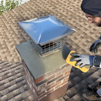 NextGen Contractors - a man working on a chimney - Masonry/Concrete Near Me