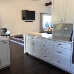 Kitchen design, cabinets and countertops. Created a new opening and extending the countertop.