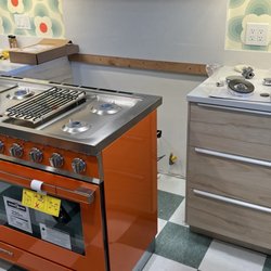 AM Home Delivery - "White glove / concierge delivery service" left stove unassembled and uninstalled in the middle of our kitchen.