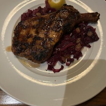 Seasons 52 - Pork chops with cabbage and white raisins. - New American Near Me - San Antonio, Texas Seasons 52 - Pork chops with cabbage and white raisins. - New American Near Me - San Antonio, Texas