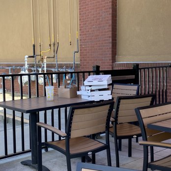 Newk's Eatery - a pizza box on a table - Pizza Near Me - Tucker, Georgia Newk's Eatery - a pizza box on a table - Pizza Near Me - Tucker, Georgia