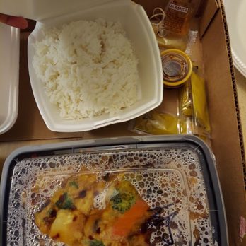 Ping House - a tray of food and a container of rice - Chinese Near Me - Miami Springs, Florida