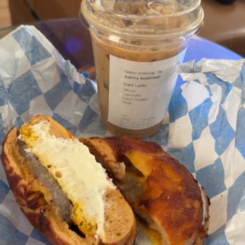 Leroy's Bagels - Sausage, Egg and American cheese with plain cream cheese on a jalapeño and cheese bagel. Side of iced lavender latte. - Bagels Near Me - Denver, Colorado
