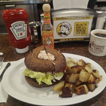 Dandee Donut Factory - Tuna salad on a pumpernickel bagel with home fries - Donuts Near Me - Pompano Beach, Florida Dandee Donut Factory - Tuna salad on a pumpernickel bagel with home fries - Donuts Near Me - Pompano Beach, Florida