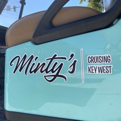 Minty’s Key West - A picture of the logo on a golf cart labeled Minty's Cruising Key West