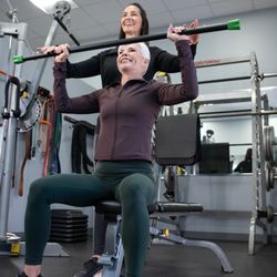 Fitness Together - Female client working with female personal working on upper body strength