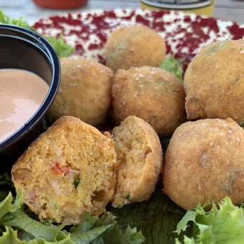 The Olde Salt House - Lobster hush puppies with spicy dipping sauce - Seafood Near Me - Cohasset, Massachusetts The Olde Salt House - Lobster hush puppies with spicy dipping sauce - Seafood Near Me - Cohasset, Massachusetts