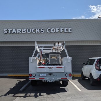 Starbucks - a white truck parked in front of a starbucks coffee shop - Coffee & Tea Near Me - Banning, California