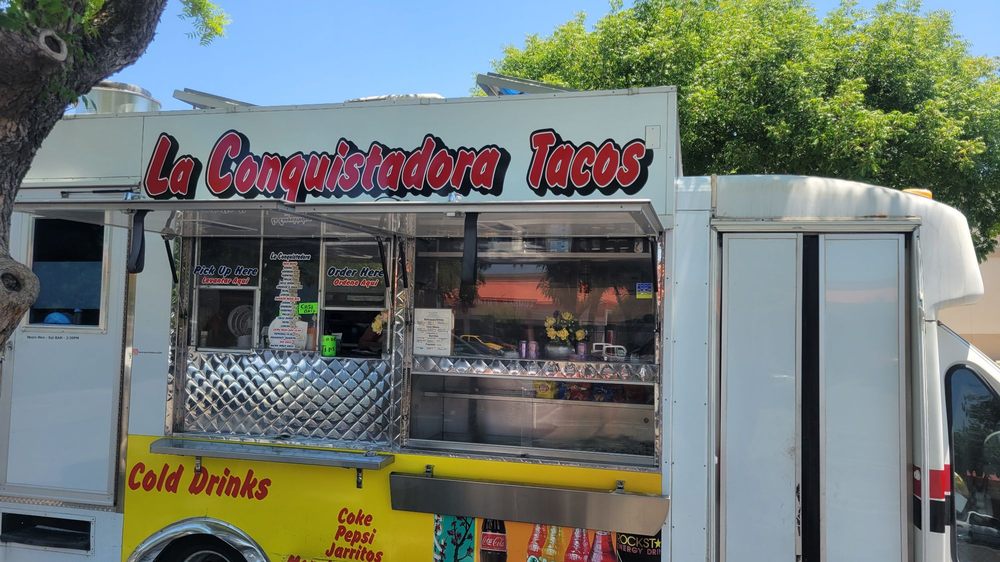 La Conquistadora Tacos Logo