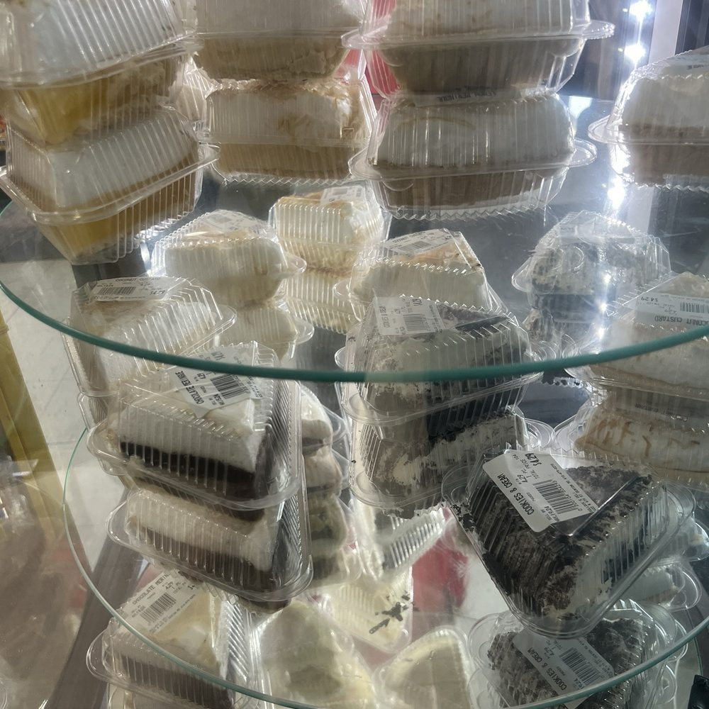 Bullock's Deli - dessert case chocolate meringue , coconut custard and cookies and cream - Delis Near Me - Denton, Maryland